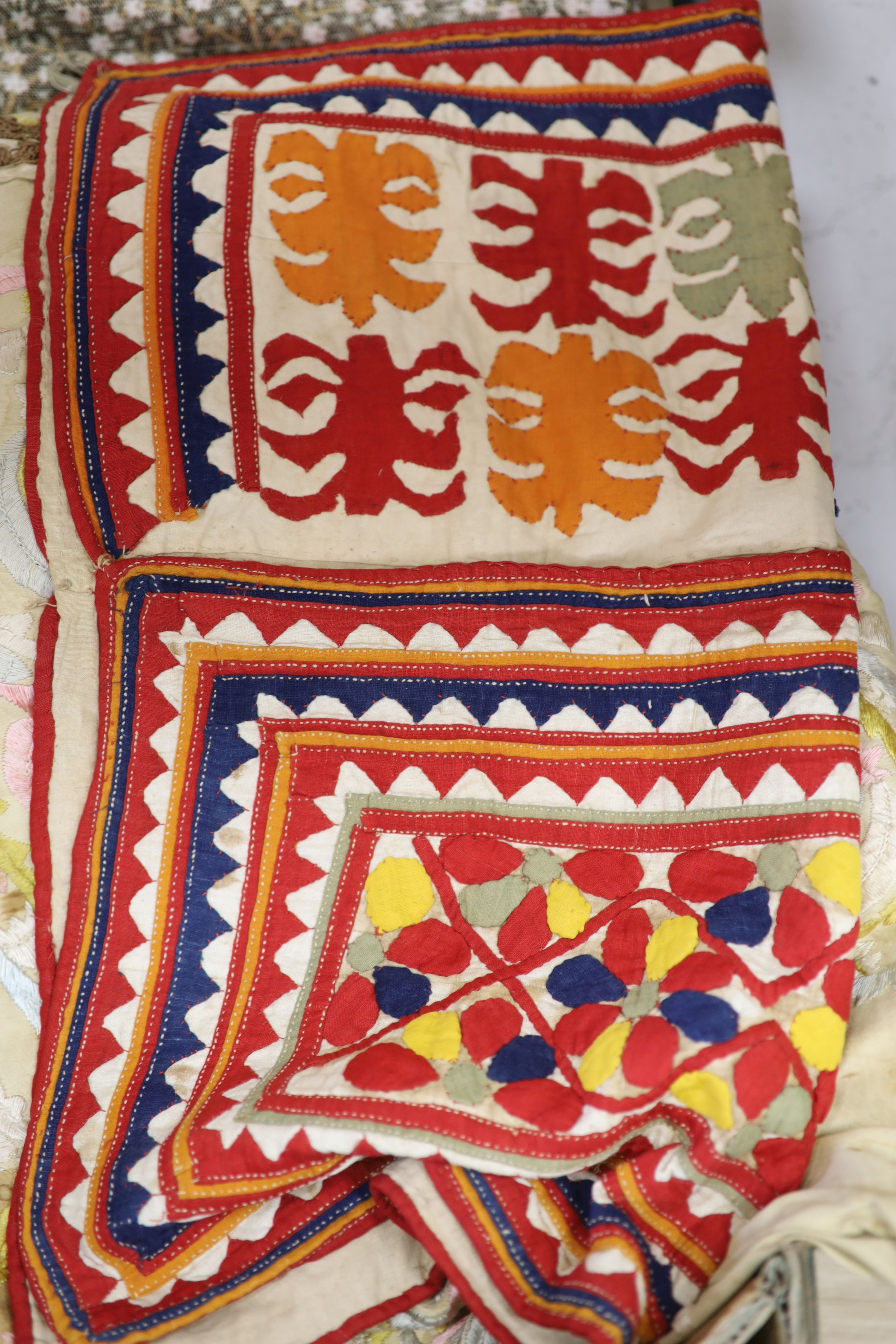 A red brocade dressing gown, embroidered silk runner, Indian panel, Liberty Morris style fabric etc